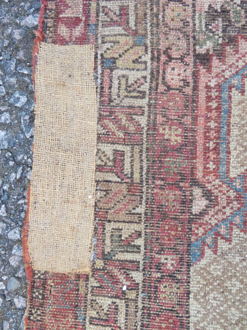 An antique hand-knotted Sarab rug with a geometric central medallion, camel hair field, and distressed terracotta borders. View XVI