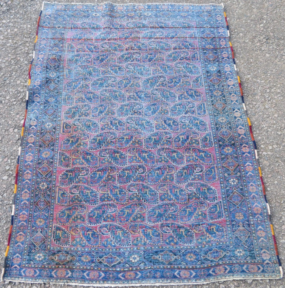 An antique hand-knotted wool Afshar tribal rug featuring a repeating boteh pattern on a terracotta field with geometric blue and cream borders. View XI