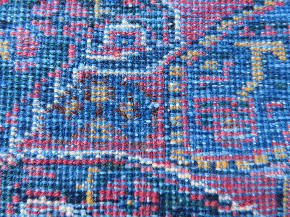 An antique hand-knotted wool Afshar tribal rug featuring a repeating boteh pattern on a terracotta field with geometric blue and cream borders. View XIV