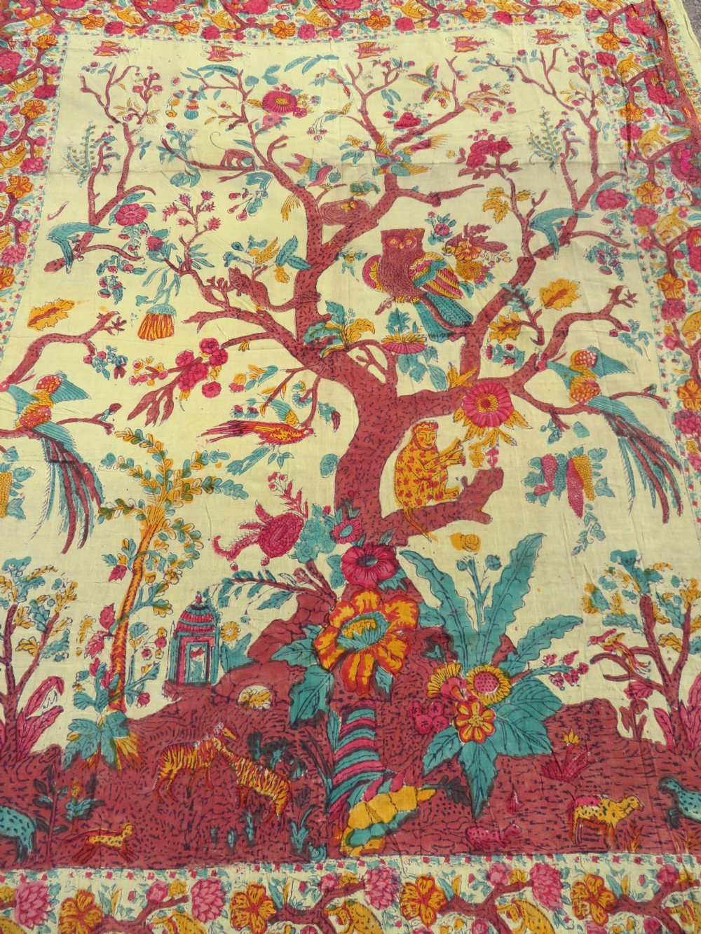 An antique 19th-century yellow cotton palampore textile featuring a centrally printed Tree of Life with birds, animals, and a pink floral border. View II