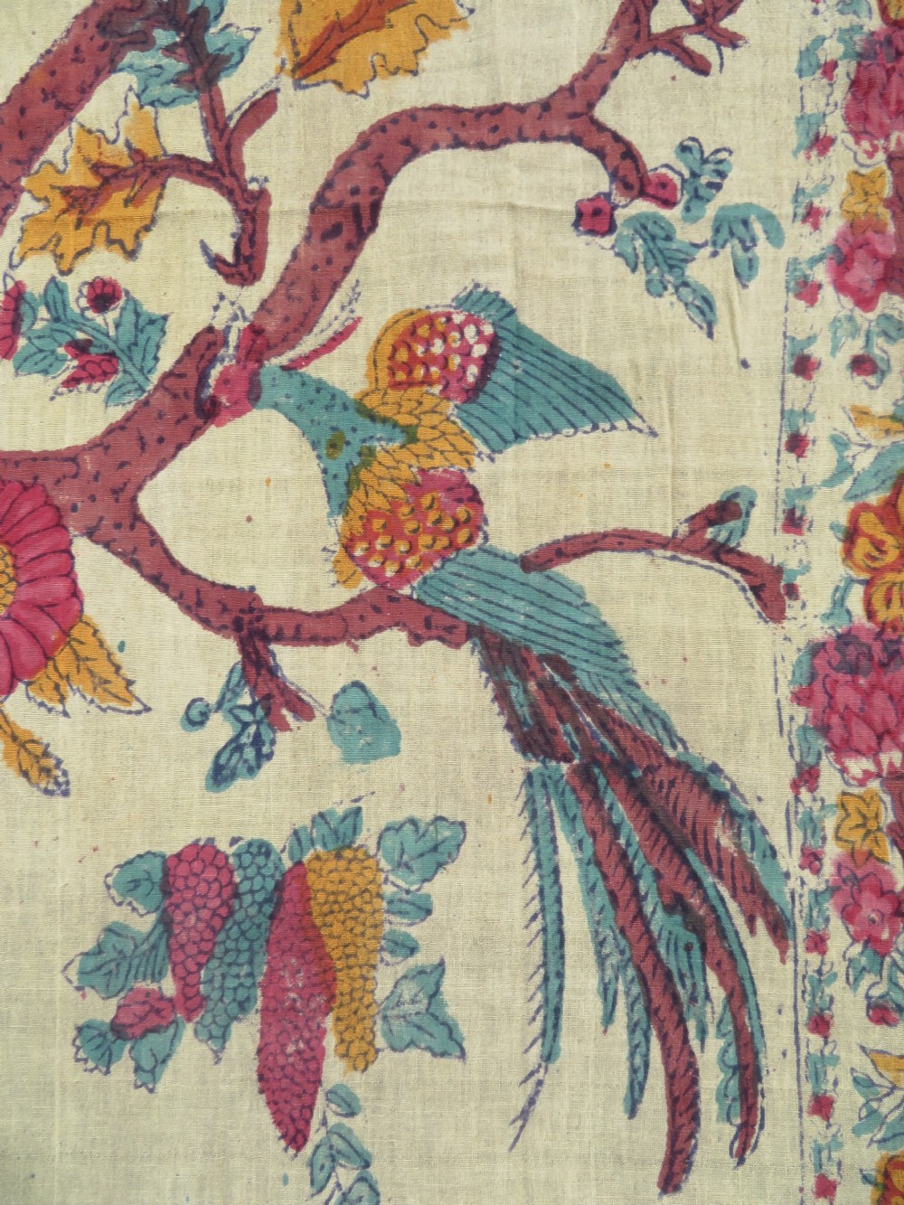 An antique 19th-century yellow cotton palampore textile featuring a centrally printed Tree of Life with birds, animals, and a pink floral border. View VI