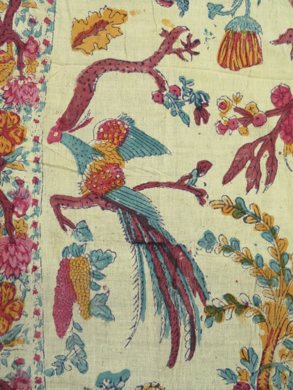An antique 19th-century yellow cotton palampore textile featuring a centrally printed Tree of Life with birds, animals, and a pink floral border. View VIII