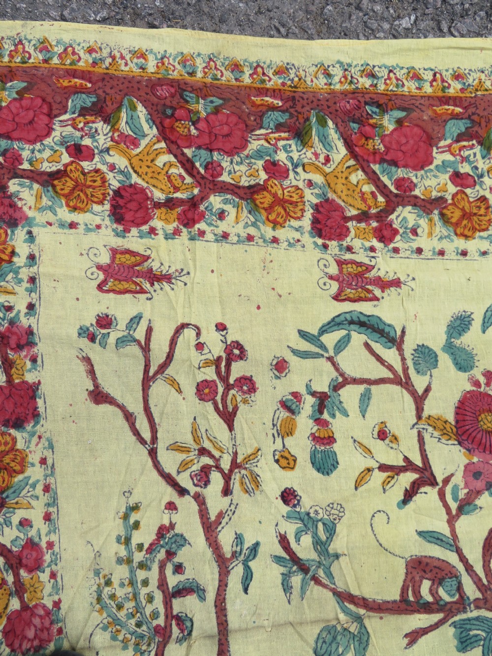 An antique 19th-century yellow cotton palampore textile featuring a centrally printed Tree of Life with birds, animals, and a pink floral border. View IX