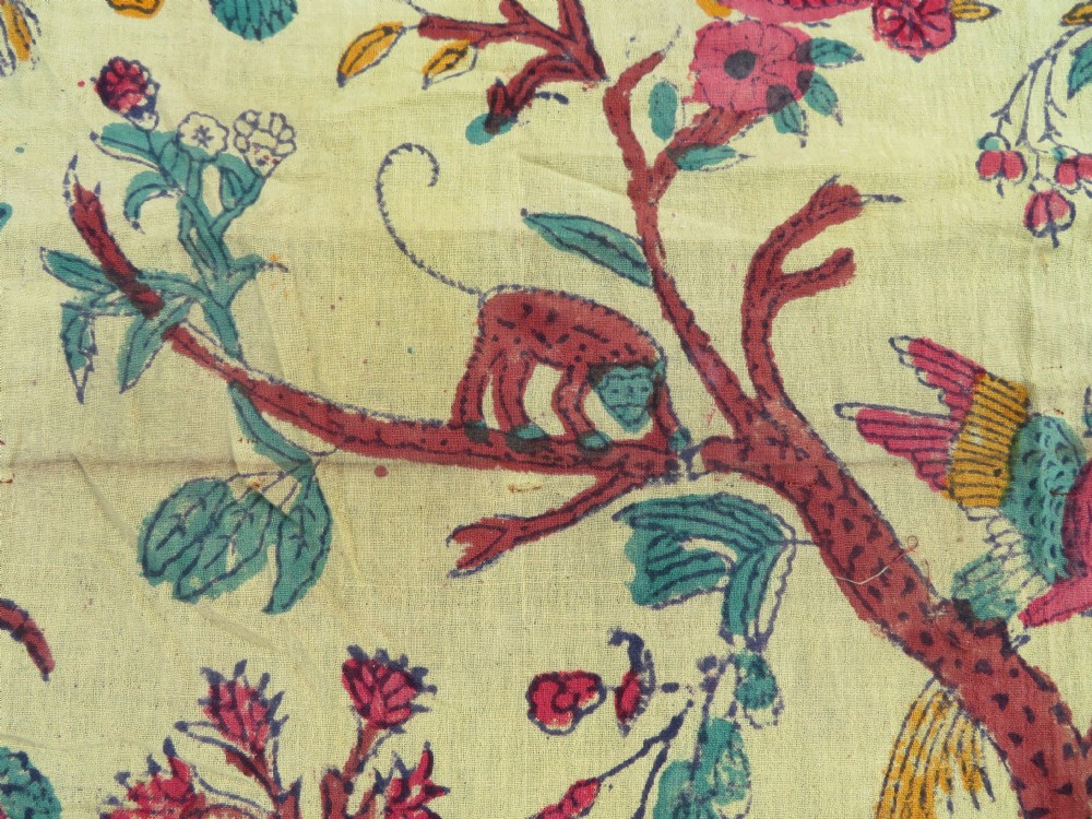 An antique 19th-century yellow cotton palampore textile featuring a centrally printed Tree of Life with birds, animals, and a pink floral border. View X