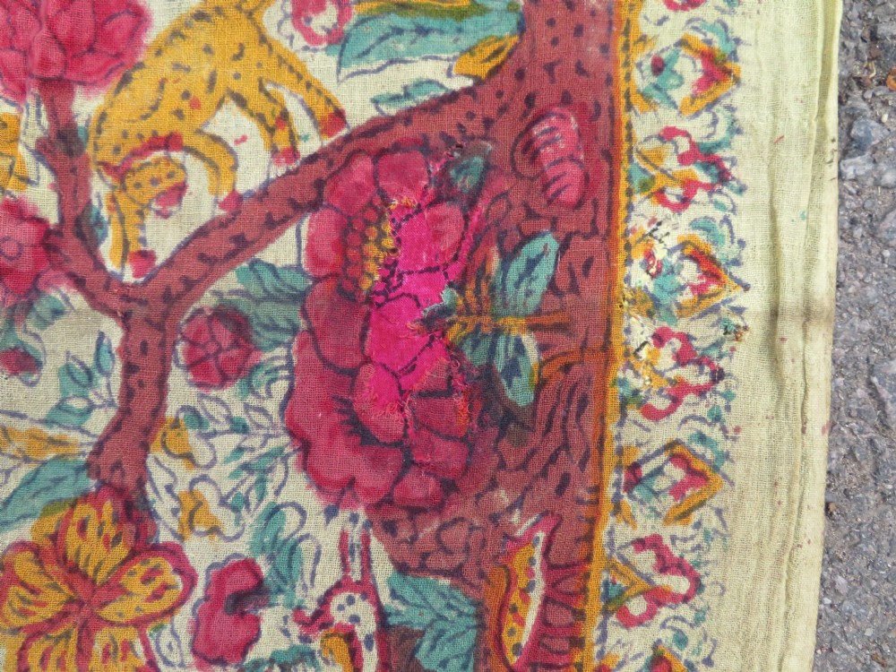 An antique 19th-century yellow cotton palampore textile featuring a centrally printed Tree of Life with birds, animals, and a pink floral border. View XVI