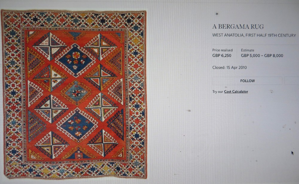 An antique hand-knotted wool rug featuring geometric diamond medallions in red, dark blue, yellow, and cream with a detailed border pattern. View XVI