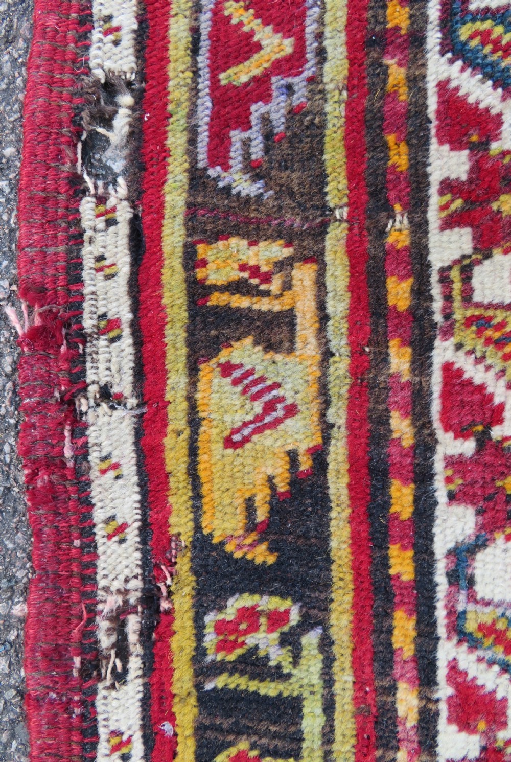An antique hand-knotted Turkish Kirsehir prayer rug featuring a central red mihrab arch framed by a yellow spandrel and multi-tiered geometric borders. View VII