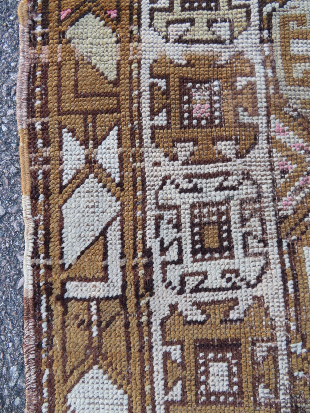 An antique Kurdish hand-knotted wool rug runner featuring repeated geometric octagonal medallions in shades of pink, tan, cream, and dark brown. View VII