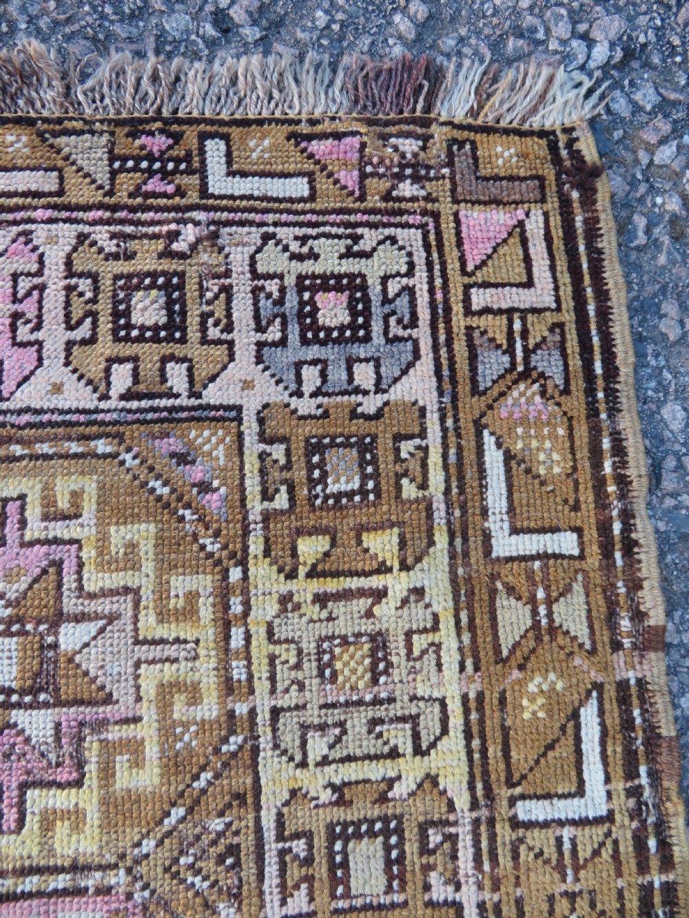 An antique Kurdish hand-knotted wool rug runner featuring repeated geometric octagonal medallions in shades of pink, tan, cream, and dark brown. View IX