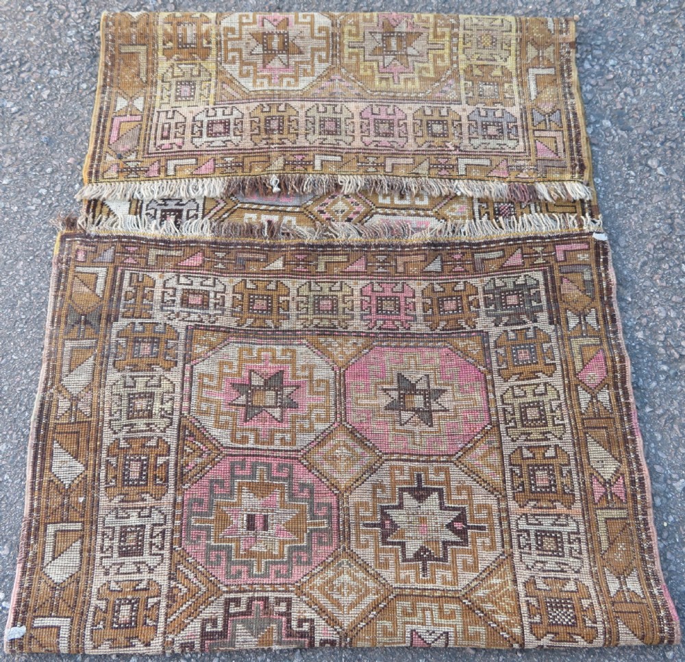 An antique Kurdish hand-knotted wool rug runner featuring repeated geometric octagonal medallions in shades of pink, tan, cream, and dark brown. View X