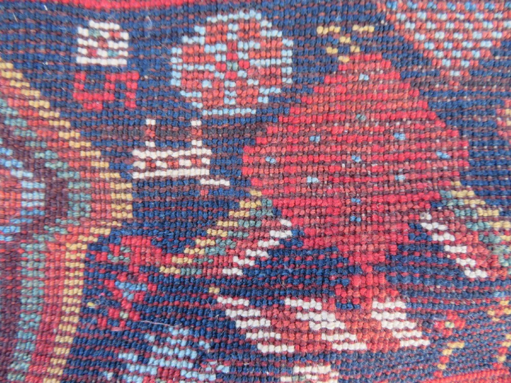An antique hand-knotted Persian Khamseh carpet featuring three central diamond pole medallions on a dark navy blue field filled with geometric tribal bird and flower motifs surrounded by intricate decorative borders. View XXV