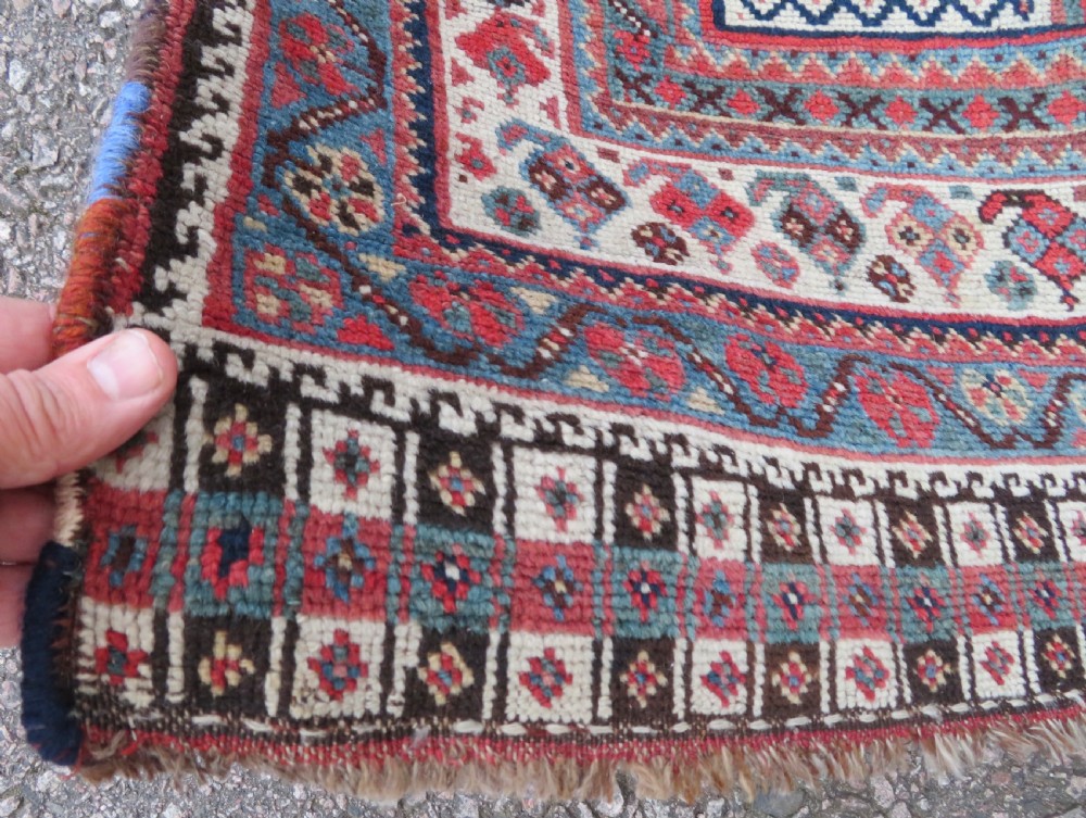 An antique hand-knotted Khamseh tribal wool rug featuring three geometric pole medallions in navy blue, terracotta red, and cream with detailed borders. View VIII