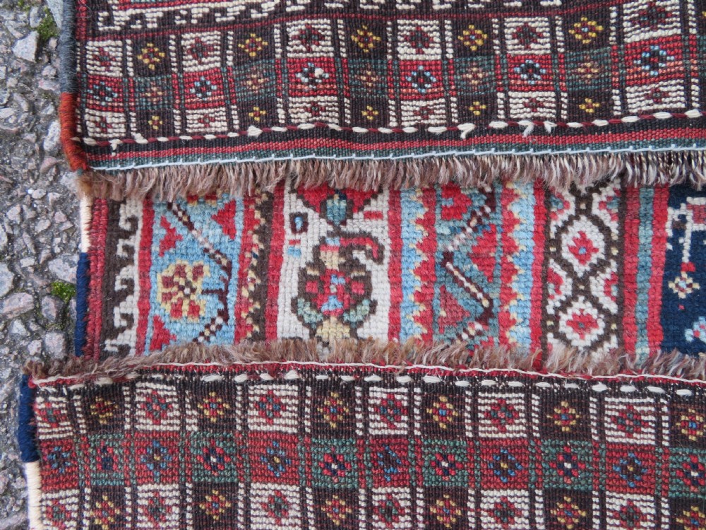 An antique hand-knotted Khamseh tribal wool rug featuring three geometric pole medallions in navy blue, terracotta red, and cream with detailed borders. View XX
