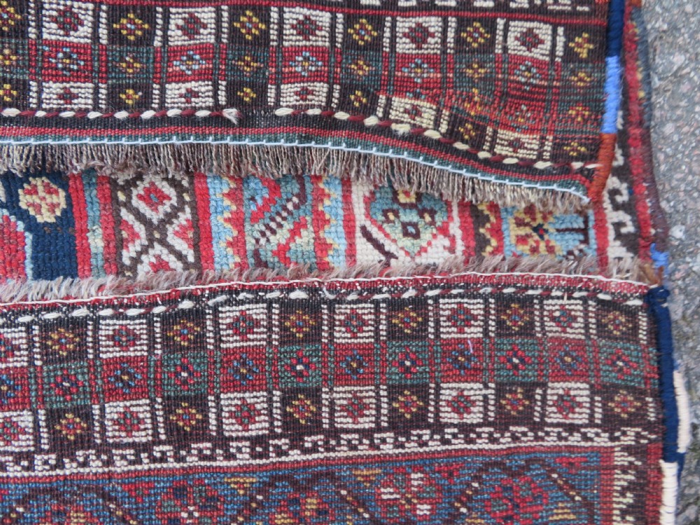 An antique hand-knotted Khamseh tribal wool rug featuring three geometric pole medallions in navy blue, terracotta red, and cream with detailed borders. View XXI