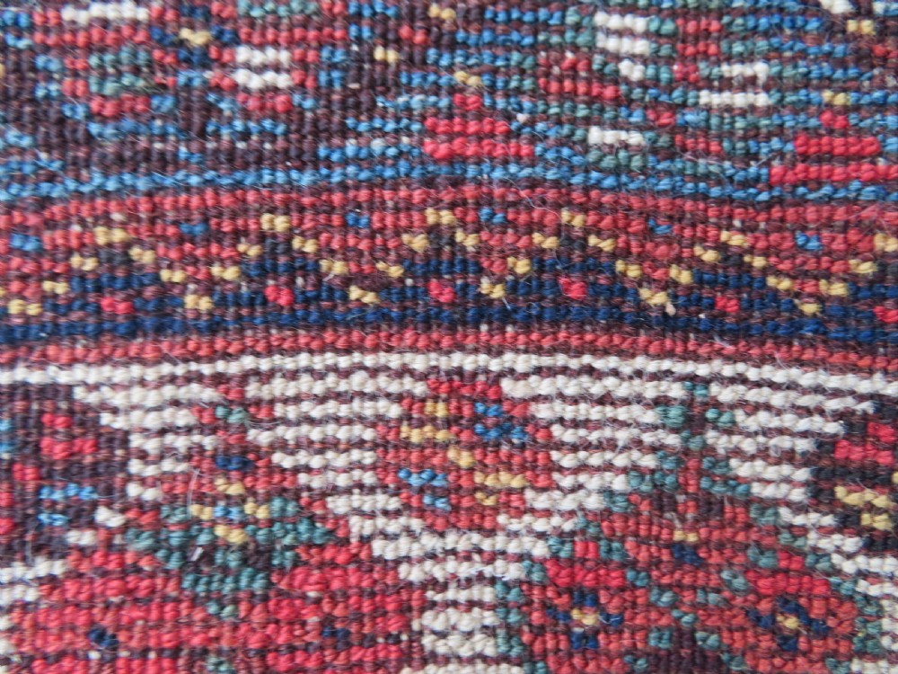 An antique hand-knotted Khamseh tribal wool rug featuring three geometric pole medallions in navy blue, terracotta red, and cream with detailed borders. View XXII