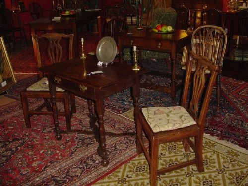 A Pair of Country Chairs in the Chippendale Style.