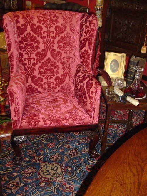 Early 19th Century Upholstered Wing Armchair.