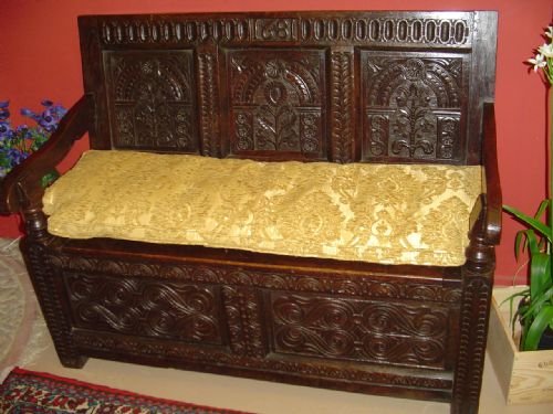 A Carved Oak Box Settle.