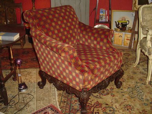 Edwardian Upholstered Wing Armchair in the Chippendale Style.