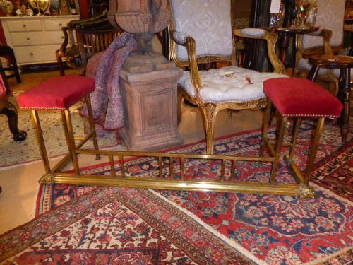 Victorian Brass Club Fender with Cushioned Red Velvet Seats.