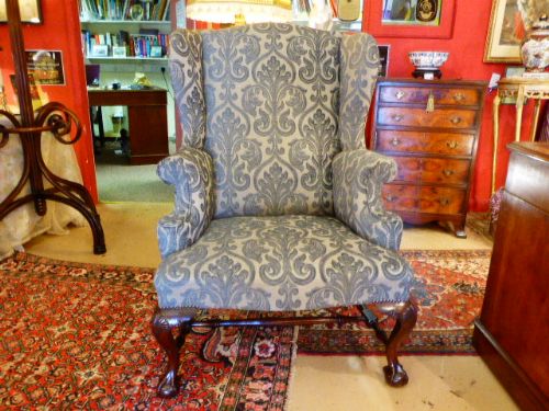19th Century Irish Mahogany Upholstered Wing Armchair.