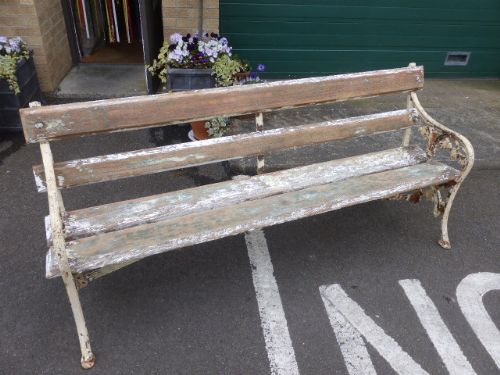A Victorian Cast Iron and Wood Slat Garden Bench.