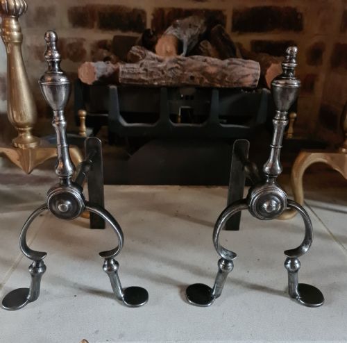 A Pair of George III Burnished Steel Fire Dogs