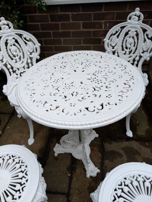 SUPERB SET OF FOUR CASTIRON GARDEN CHAIRS TOGETHER WITH RARE CHRISTOPHER DRESSER DESIGN TABLE - ADDITIONAL PHOTO 4