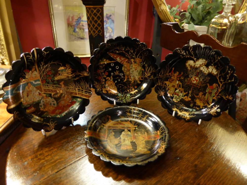Set of Four Papier Mache Chinoiserie Design Plates.