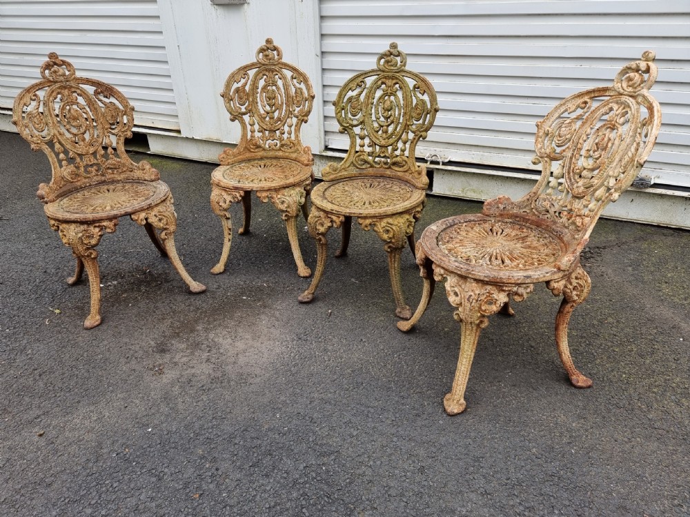 Good set of Four Victorian heavy Cast-iron Garden Chairs View II
