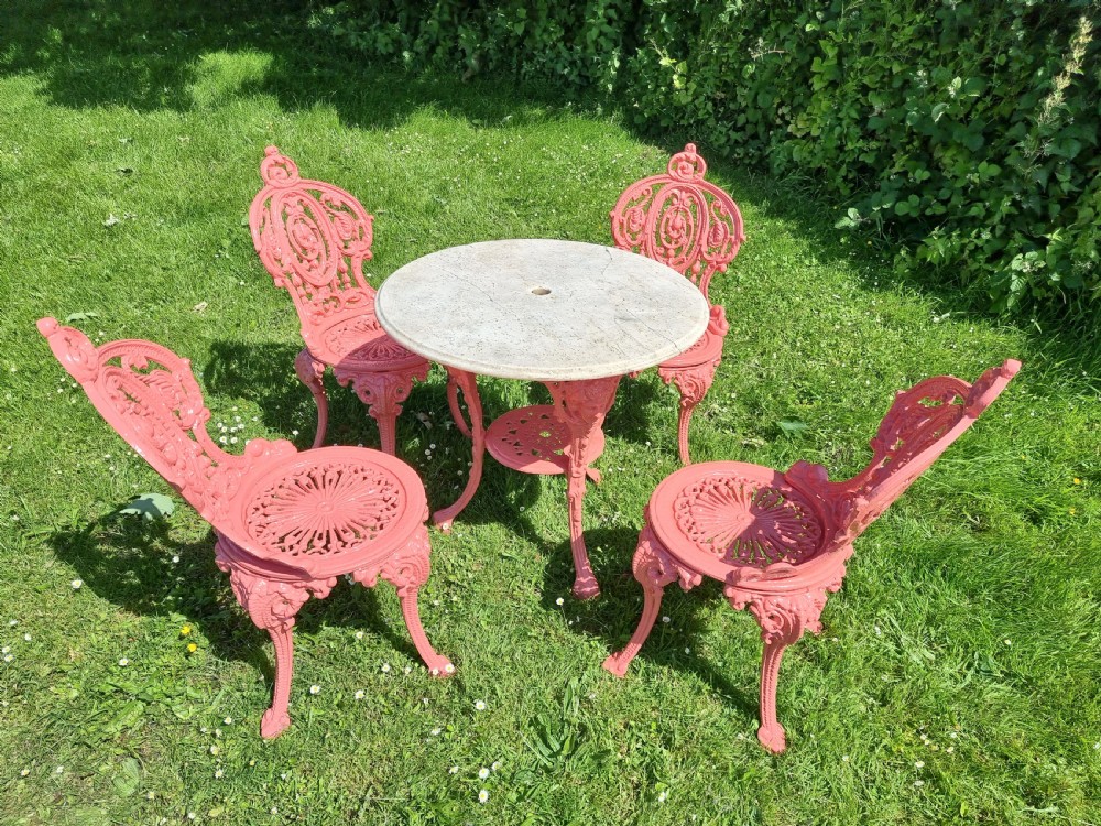Set of Four Cast-iron Garden Chairs together with a cast-iron Table with Marble Top
