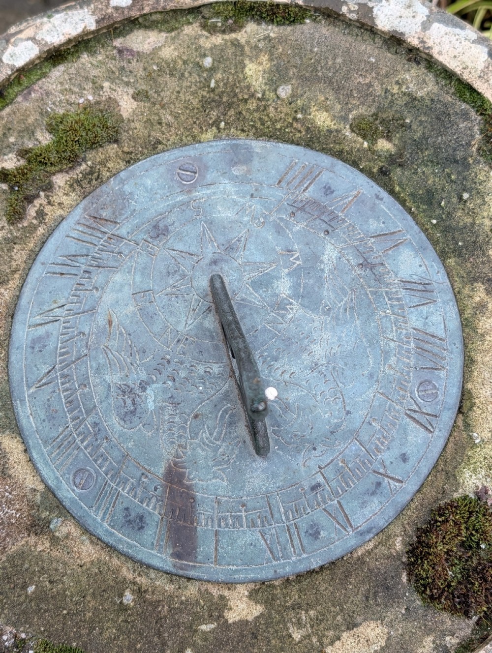 A nineteenth-century Victorian terracotta chimney pot repurposed as a garden sundial with a circular lead dial and gnomon. View IV