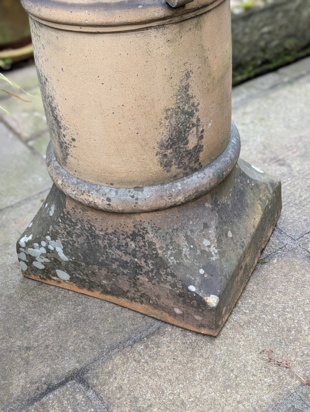 A nineteenth-century Victorian terracotta chimney pot repurposed as a garden sundial with a circular lead dial and gnomon. View VII