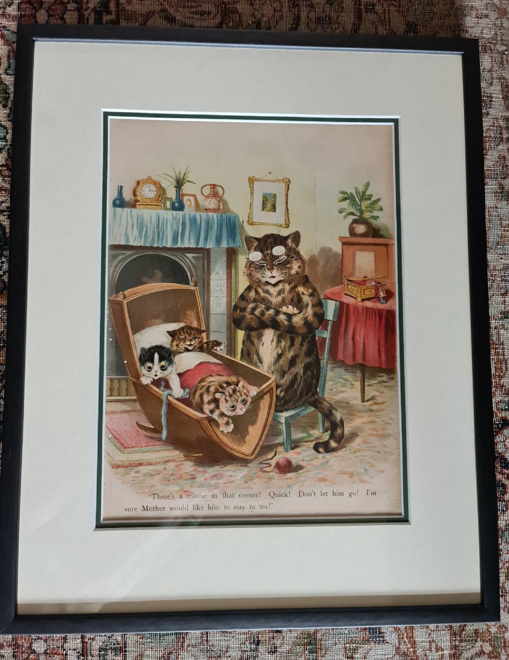 A pair of black framed antique prints depicting anthropomorphic cats in domestic interior scenes with printed text captions. View VI