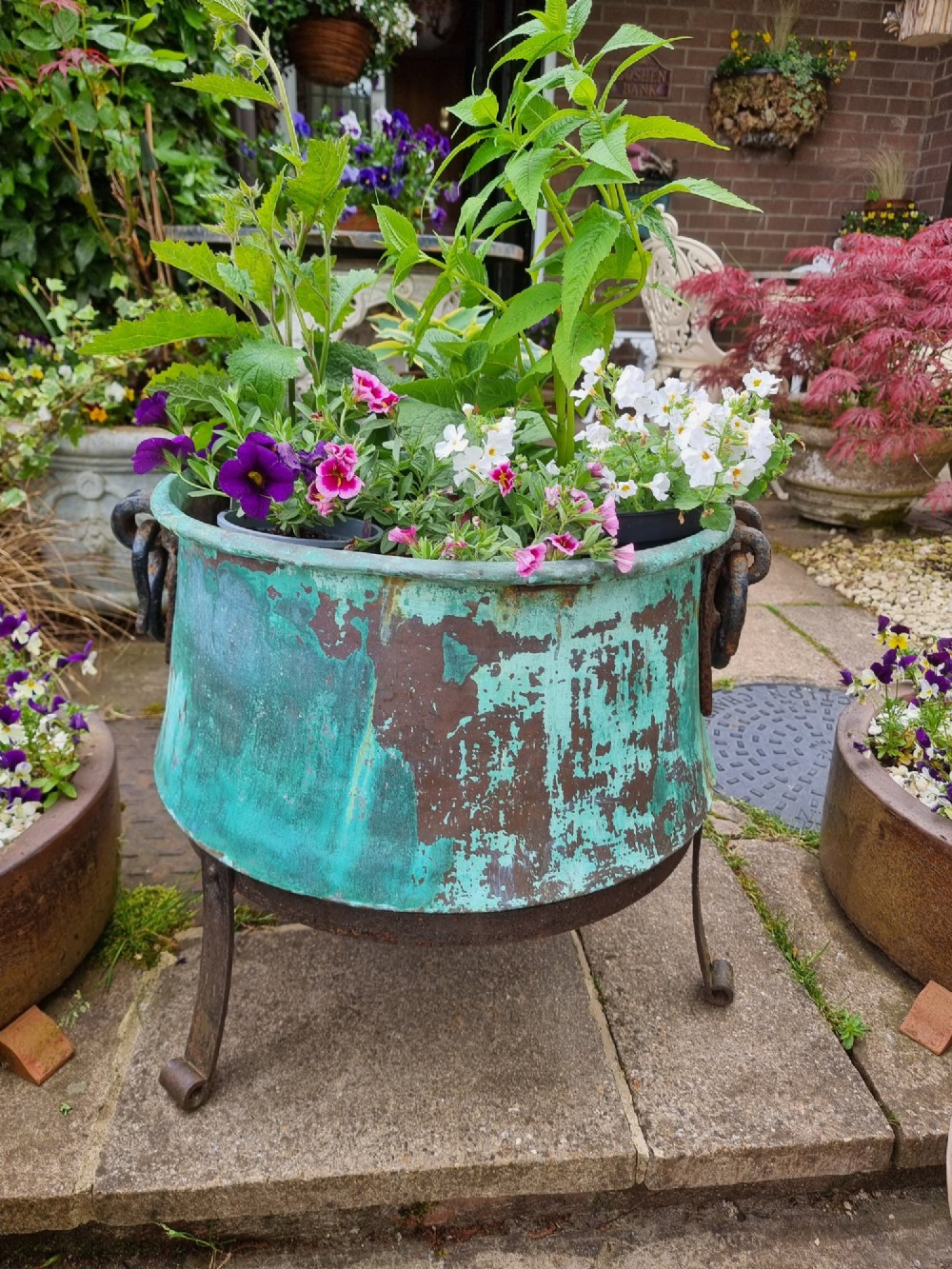 A large circular 19th-century copper vessel with a heavy verdigris green patina and dual wrought-iron drop handles. View III