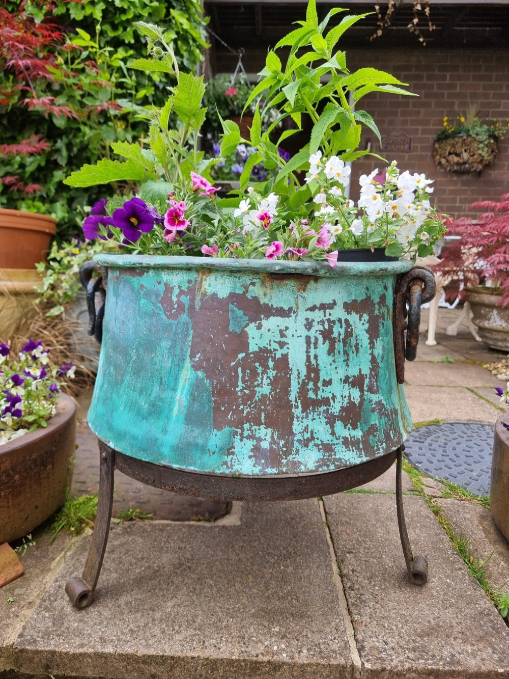 A large circular 19th-century copper vessel with a heavy verdigris green patina and dual wrought-iron drop handles. View IV