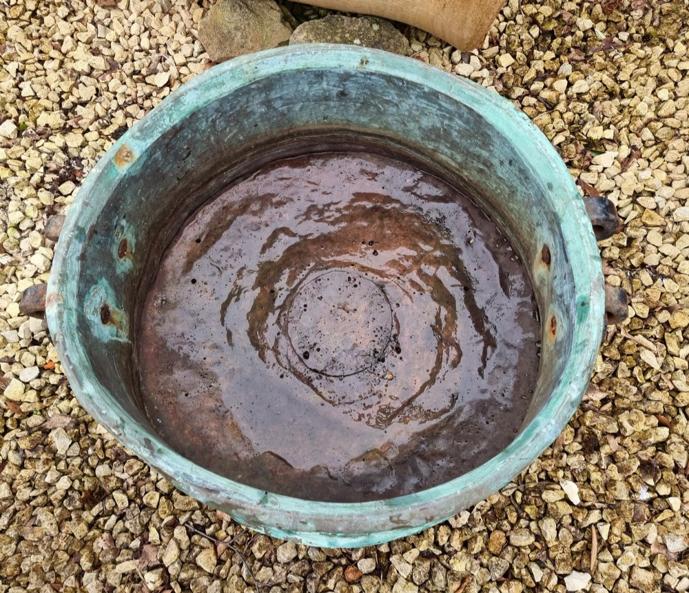 A large circular 19th-century copper vessel with a heavy verdigris green patina and dual wrought-iron drop handles. View VII