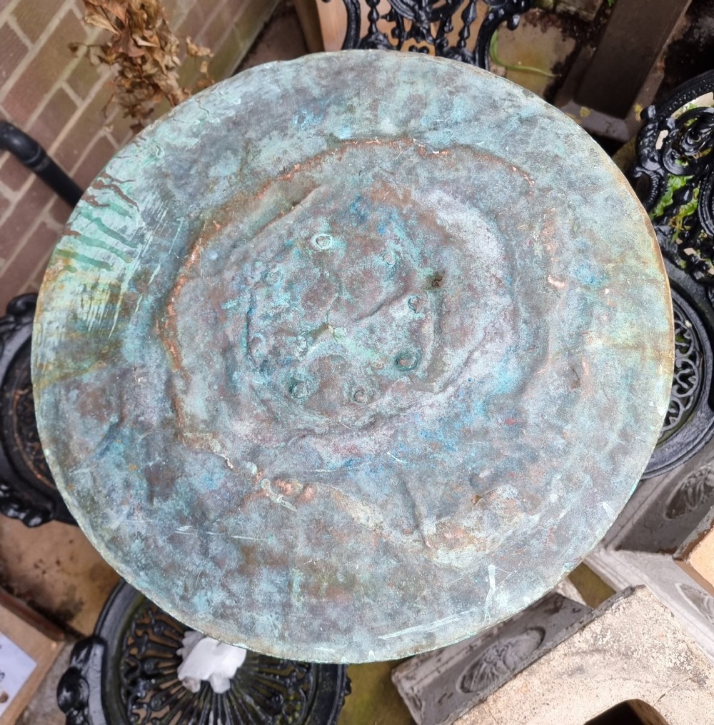 A large circular 19th-century copper vessel with a heavy verdigris green patina and dual wrought-iron drop handles. View X