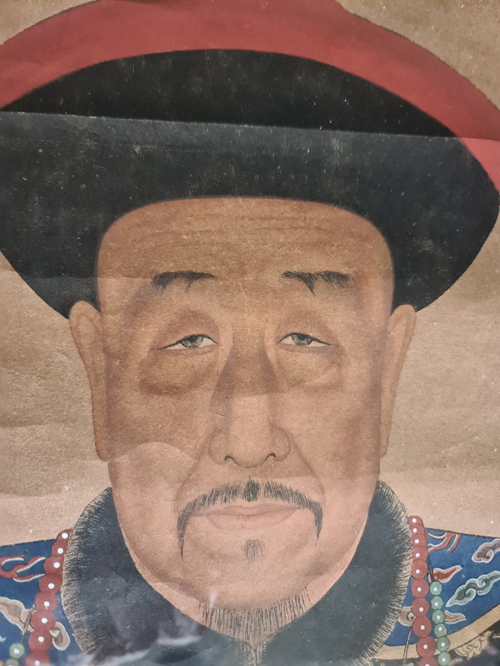 A large pair of framed Chinese ancestral portraits depicting a male and female figure in traditional formal court robes seated on ornate thrones. View IV