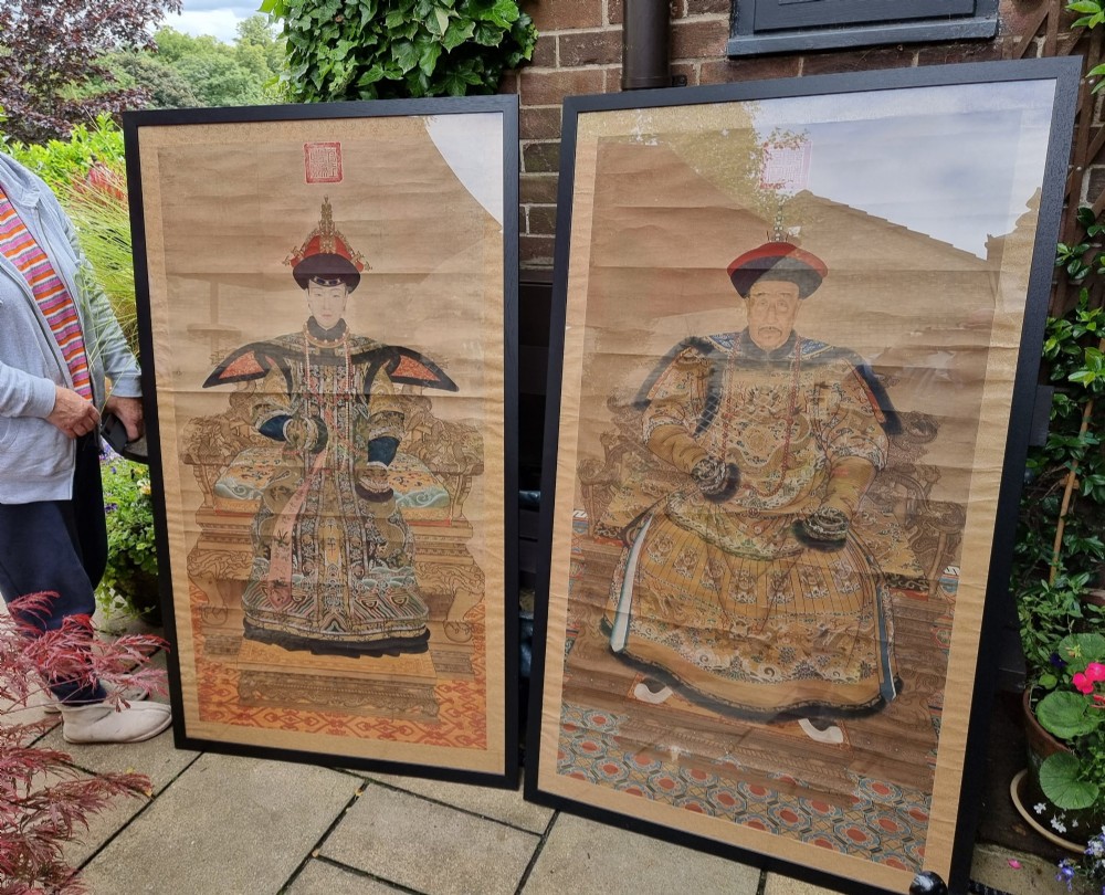 A large pair of framed Chinese ancestral portraits depicting a male and female figure in traditional formal court robes seated on ornate thrones. View X