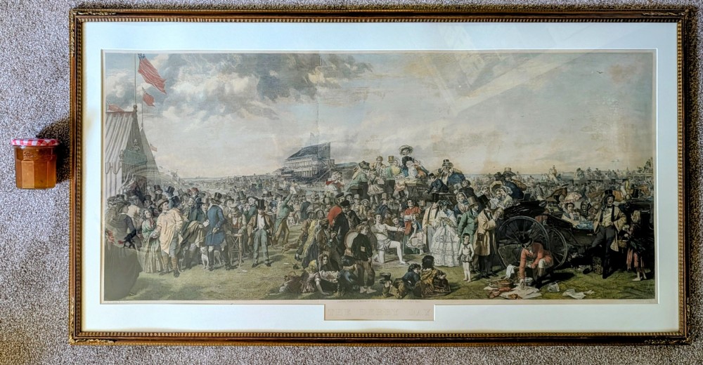 A panoramic 19th-century framed print depicting a densely populated scene at the Epsom Derby within a cream mount and gilt wooden frame. View II