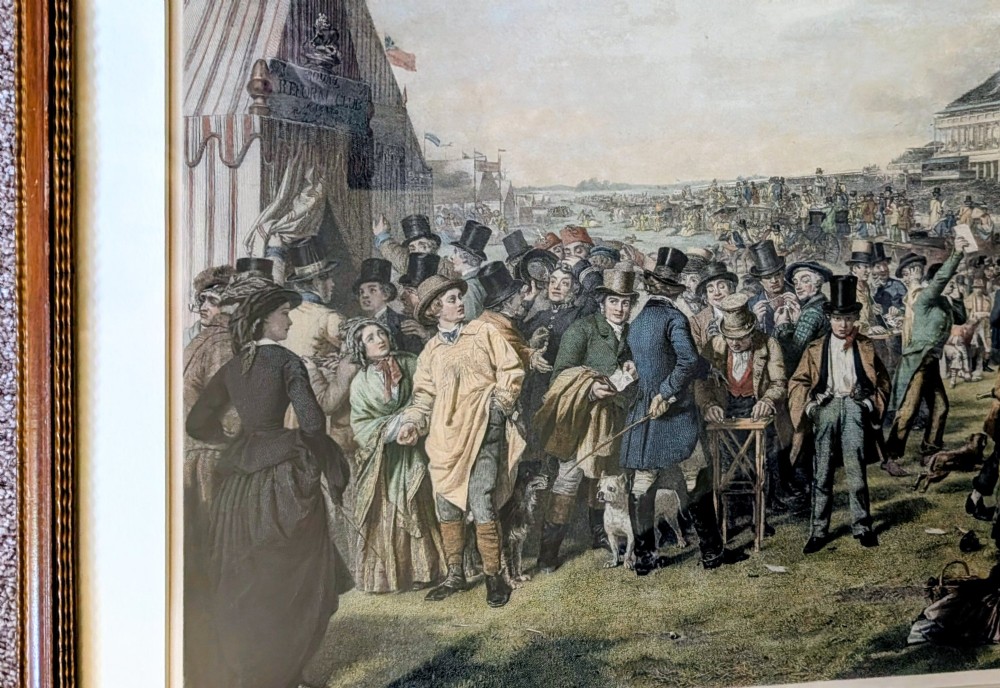A panoramic 19th-century framed print depicting a densely populated scene at the Epsom Derby within a cream mount and gilt wooden frame. View III