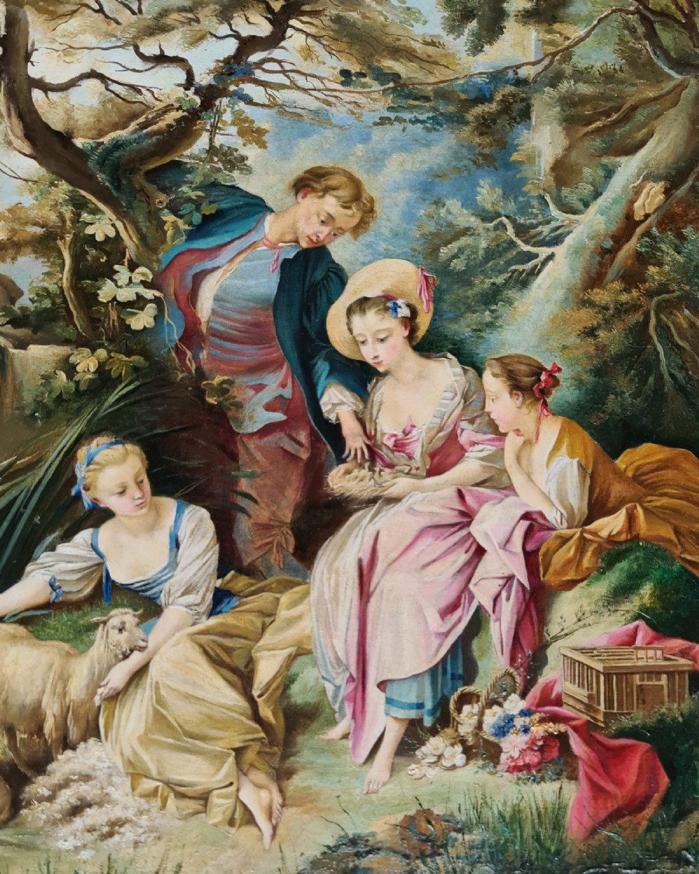 An oil painting depicting a Rococo pastoral scene with figures and sheep by a stream, set within a heavy gilded frame. View IV
