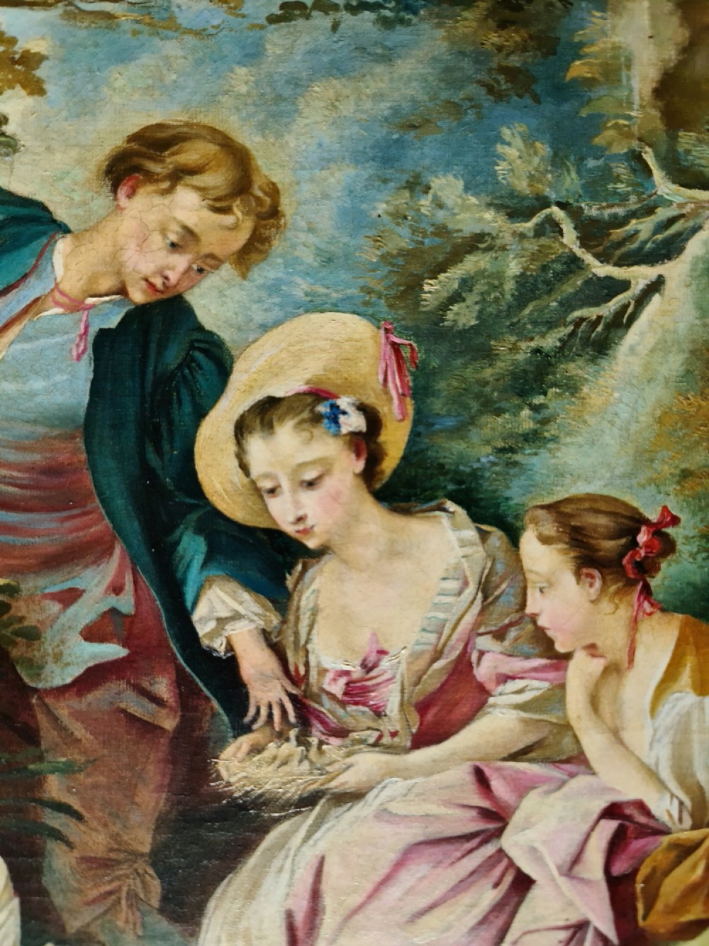 An oil painting depicting a Rococo pastoral scene with figures and sheep by a stream, set within a heavy gilded frame. View IX