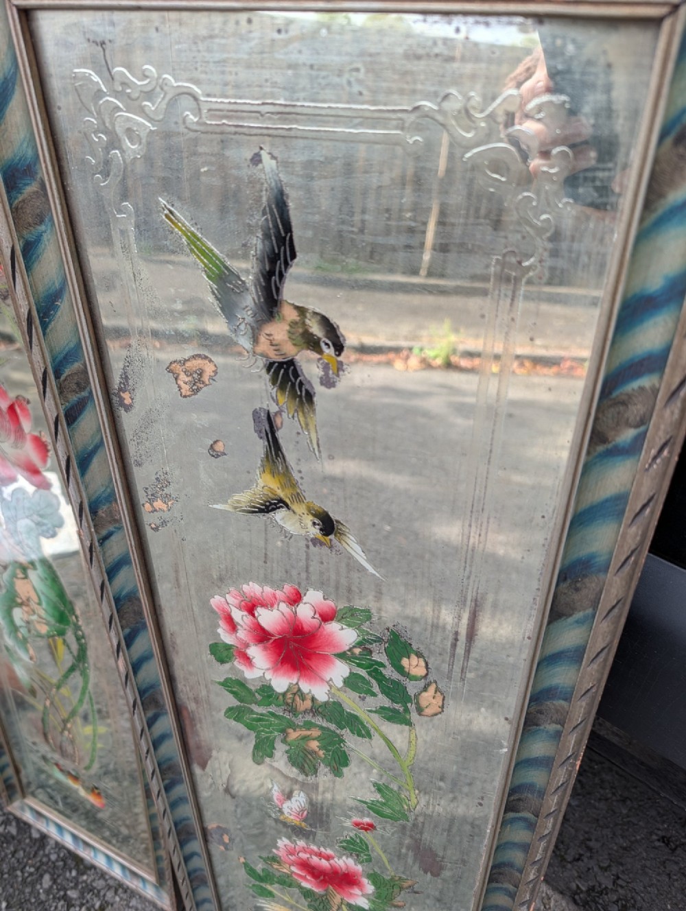 A pair of rectangular Chinese reverse-painted wall mirrors featuring floral, bird, and rooster illustrations against a distressed silvered glass background with striped frames. View II