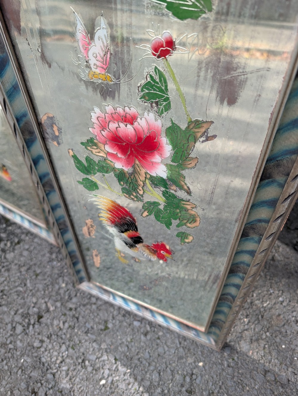 A pair of rectangular Chinese reverse-painted wall mirrors featuring floral, bird, and rooster illustrations against a distressed silvered glass background with striped frames. View III