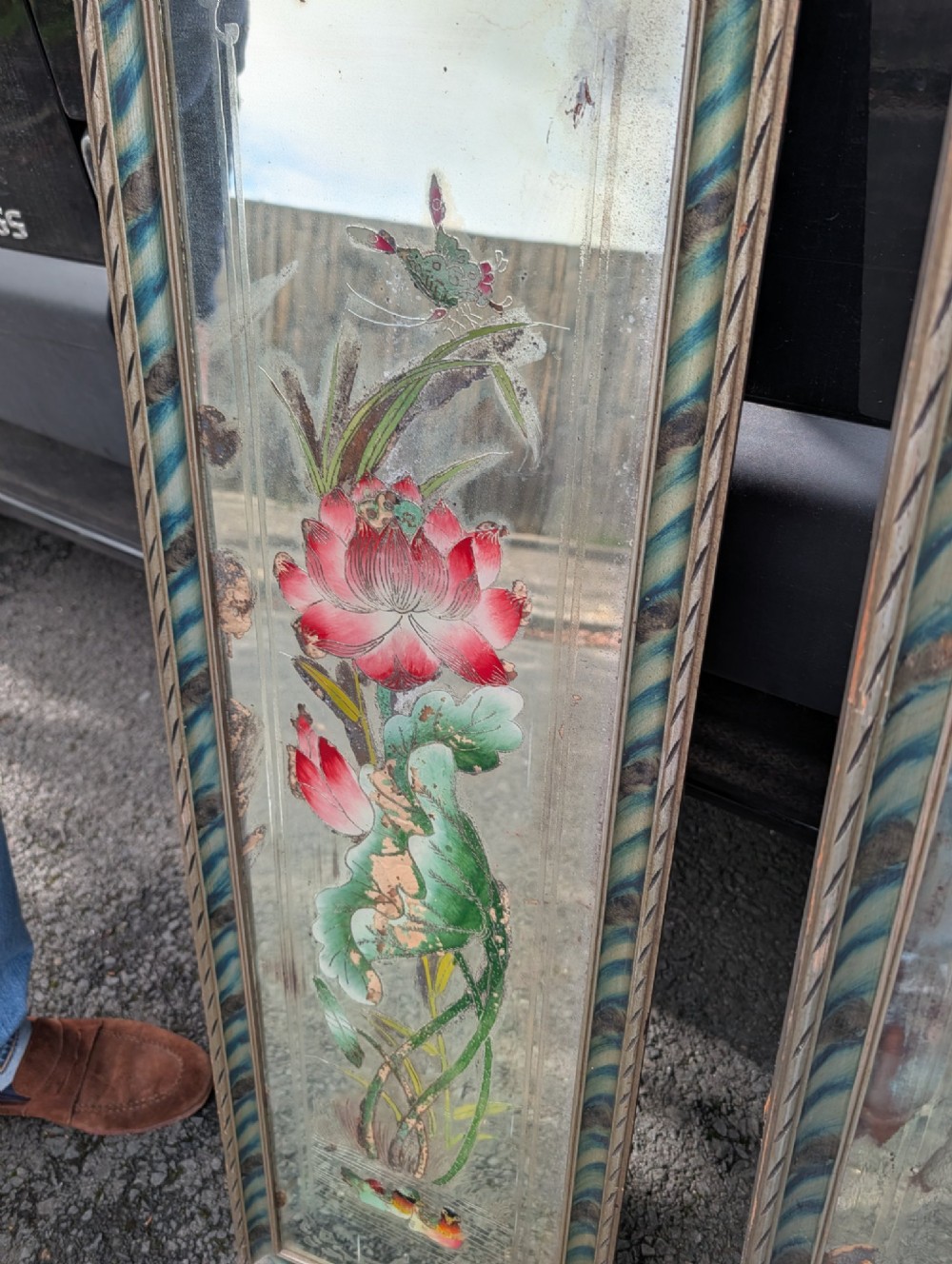 A pair of rectangular Chinese reverse-painted wall mirrors featuring floral, bird, and rooster illustrations against a distressed silvered glass background with striped frames. View IV