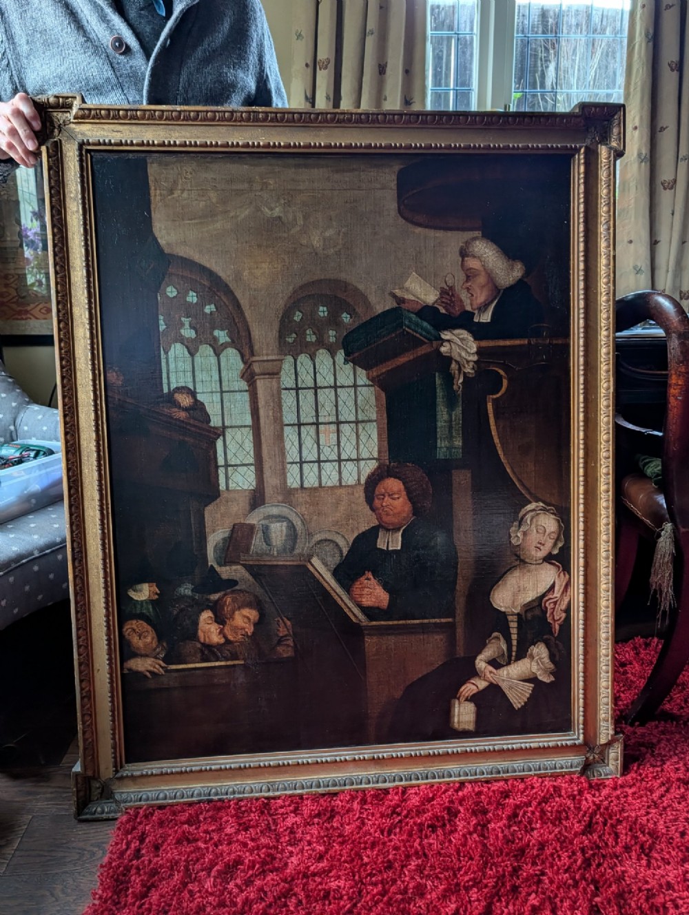An antique oil painting on canvas depicting a sleeping church congregation inside a moulded giltwood frame. View V
