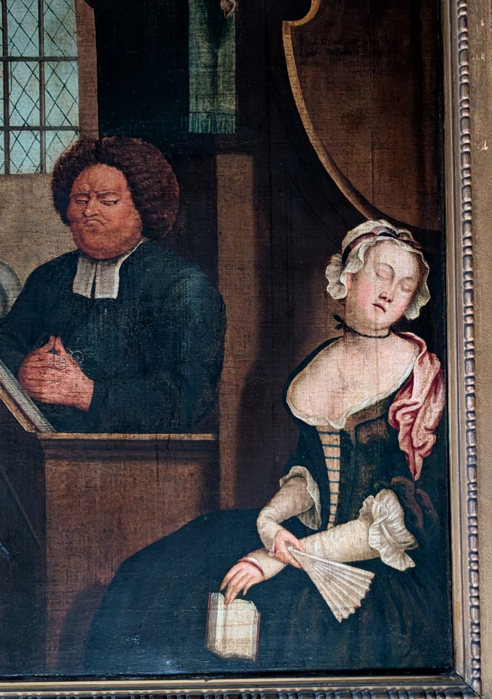 An antique oil painting on canvas depicting a sleeping church congregation inside a moulded giltwood frame. View VIII