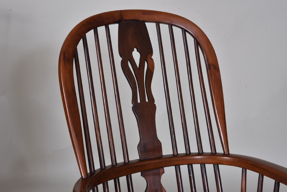 A pair of 19th-century yew wood Windsor armchairs with hoop backs, pierced splats, turned legs, and crinoline stretchers. View III